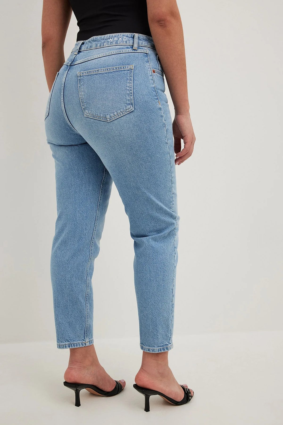 Model Wearing Light Blue Mom High Waist Jeans