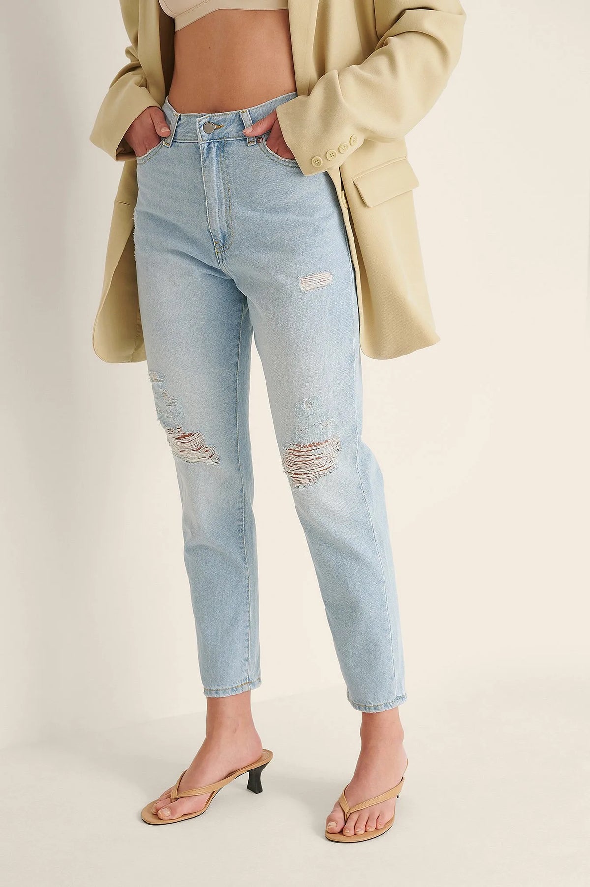 Side View of Light Blue Ripped Mom Jeans