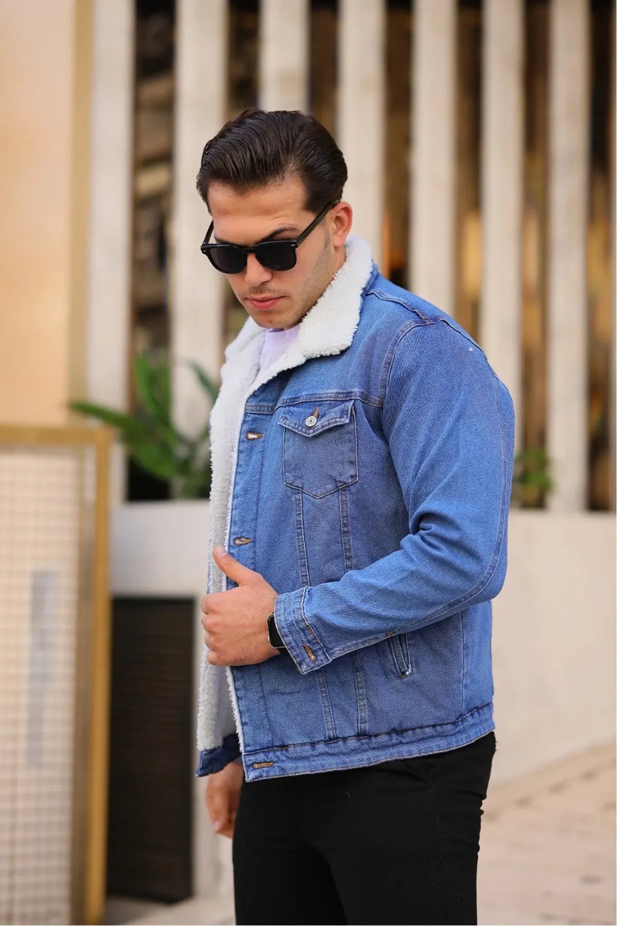 Light blue denim jacket with soft white fur lining, perfect for men’s winter fashion.