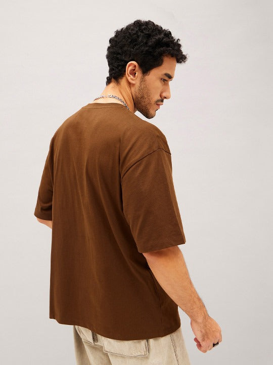 Unisex Brown Typography Printed Pure Cotton Oversized T-shirt – Premium Streetwear Style for Men & Women in Pakistan | DOCACCA